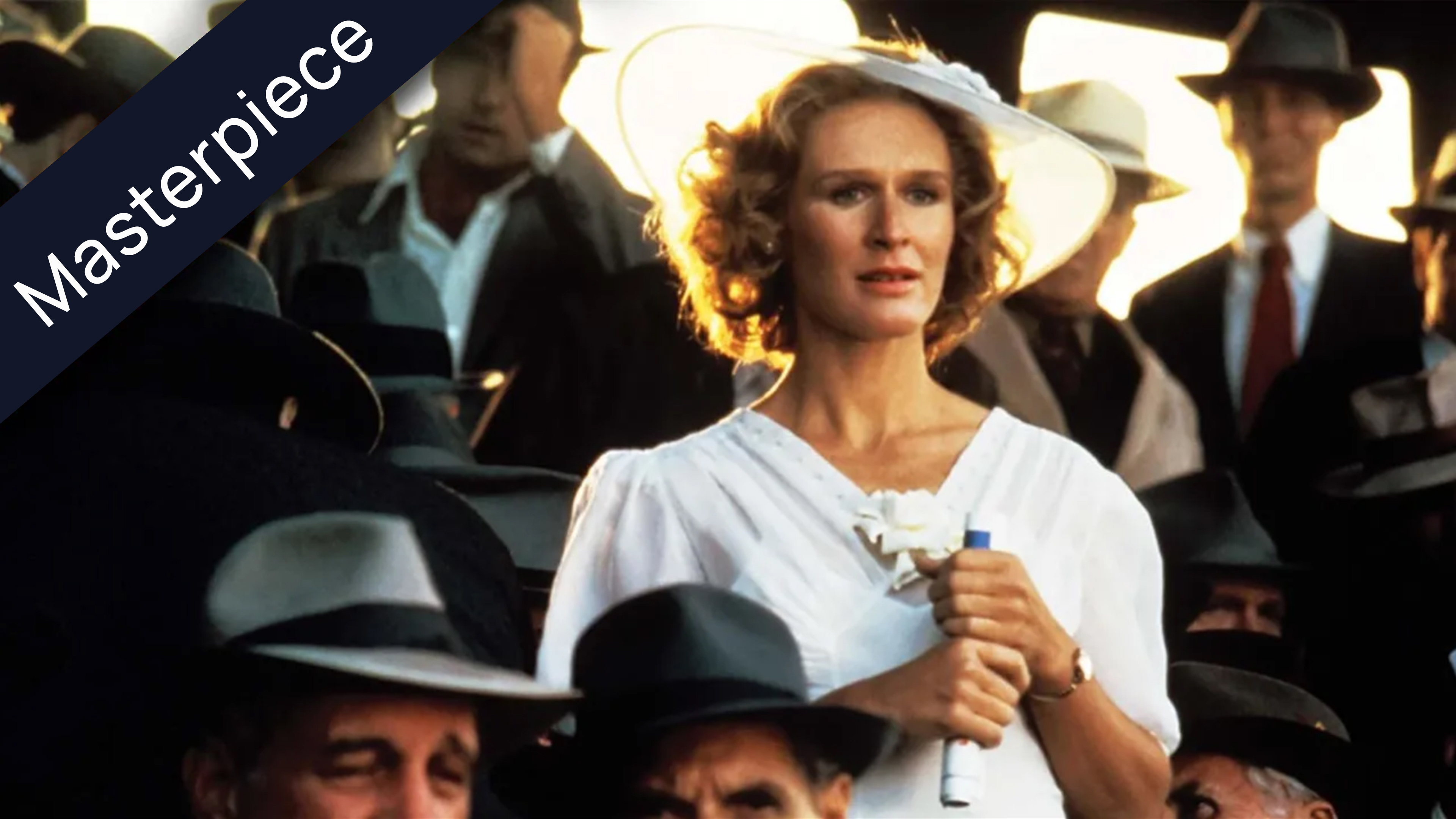 Glenn Glose in white dress and hat with the sun behind her head in The Natural movie scene labeled Masterpiece